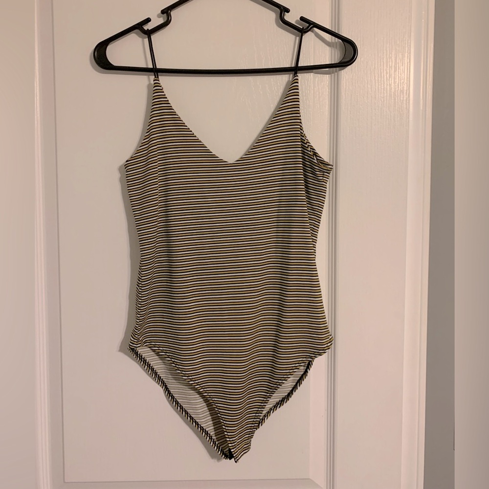 Black white and yellow striped bodysuit. Worn once. Women’s medium